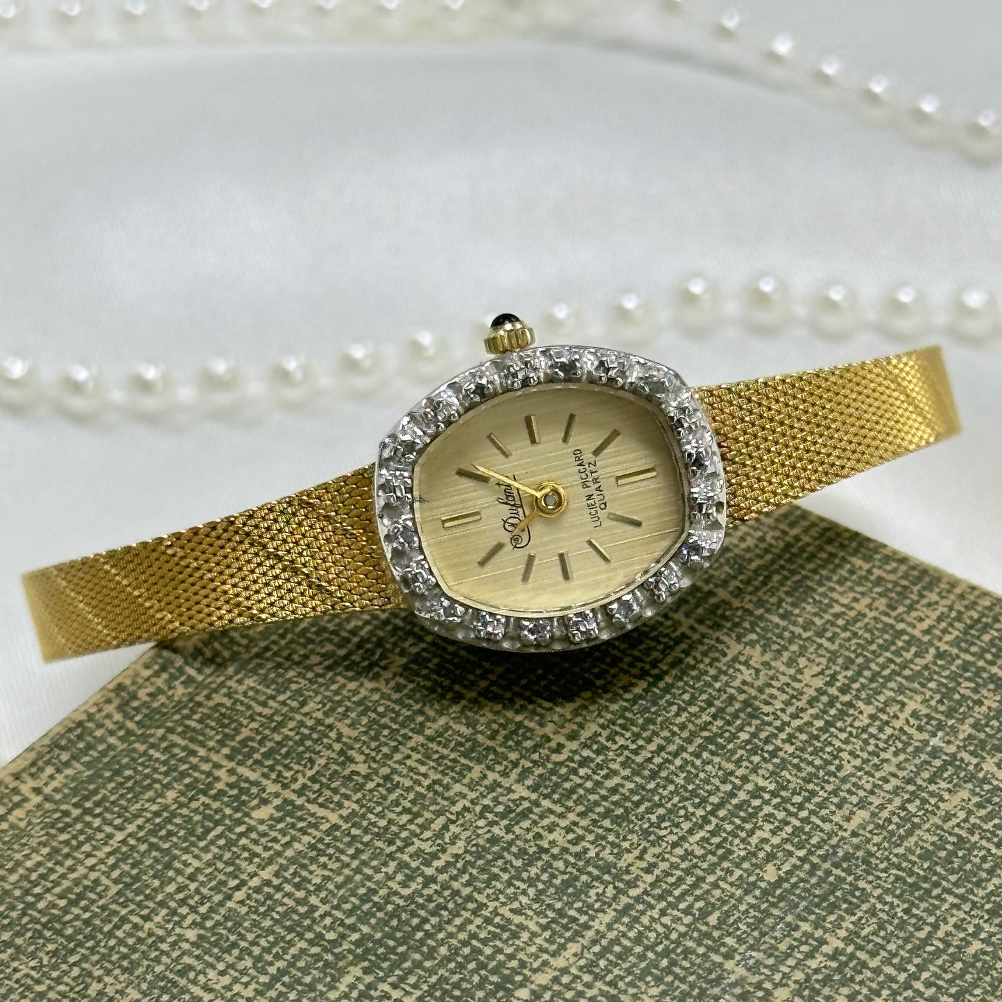 Gold Diamanté Lucien Piccard Watch with Blue Jewel Crown