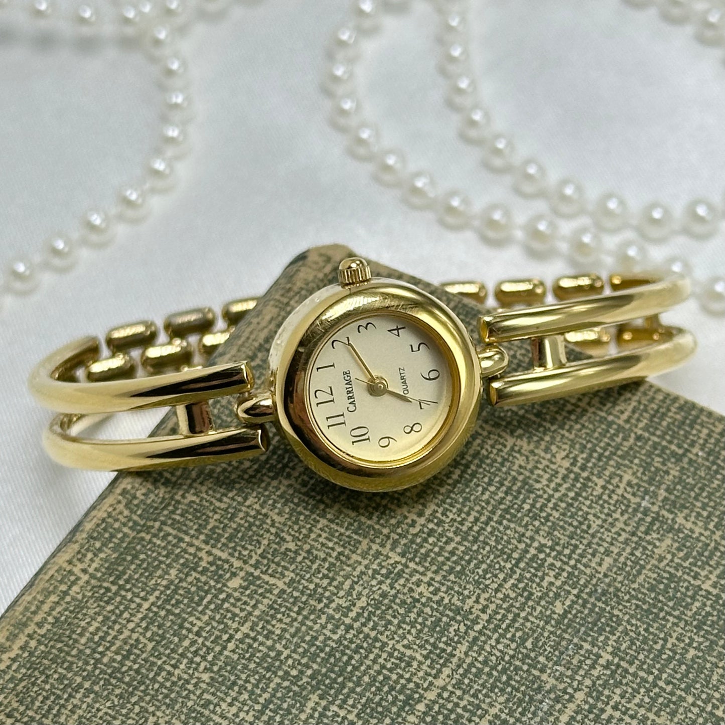 Gold Carriage Cuff Watch