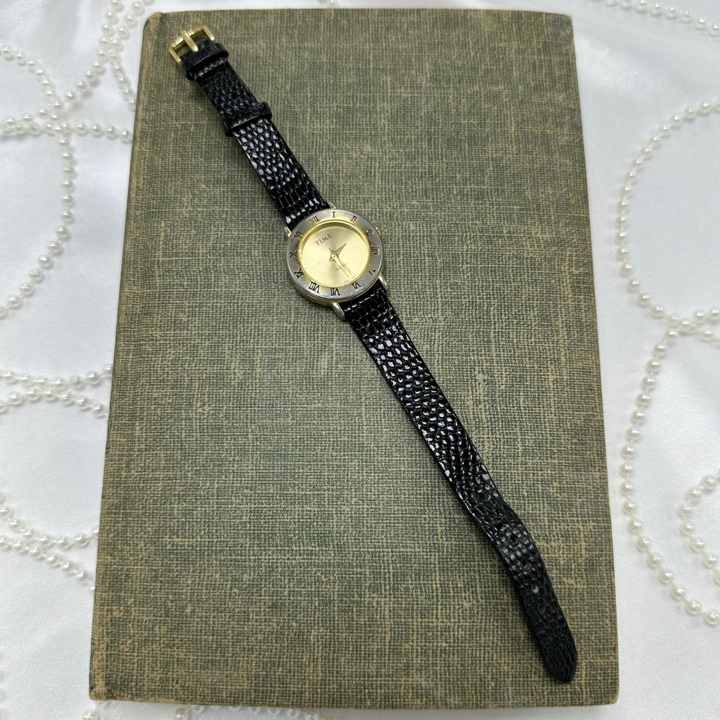 Gold Round Dial Watch with Roman Numeral Markers