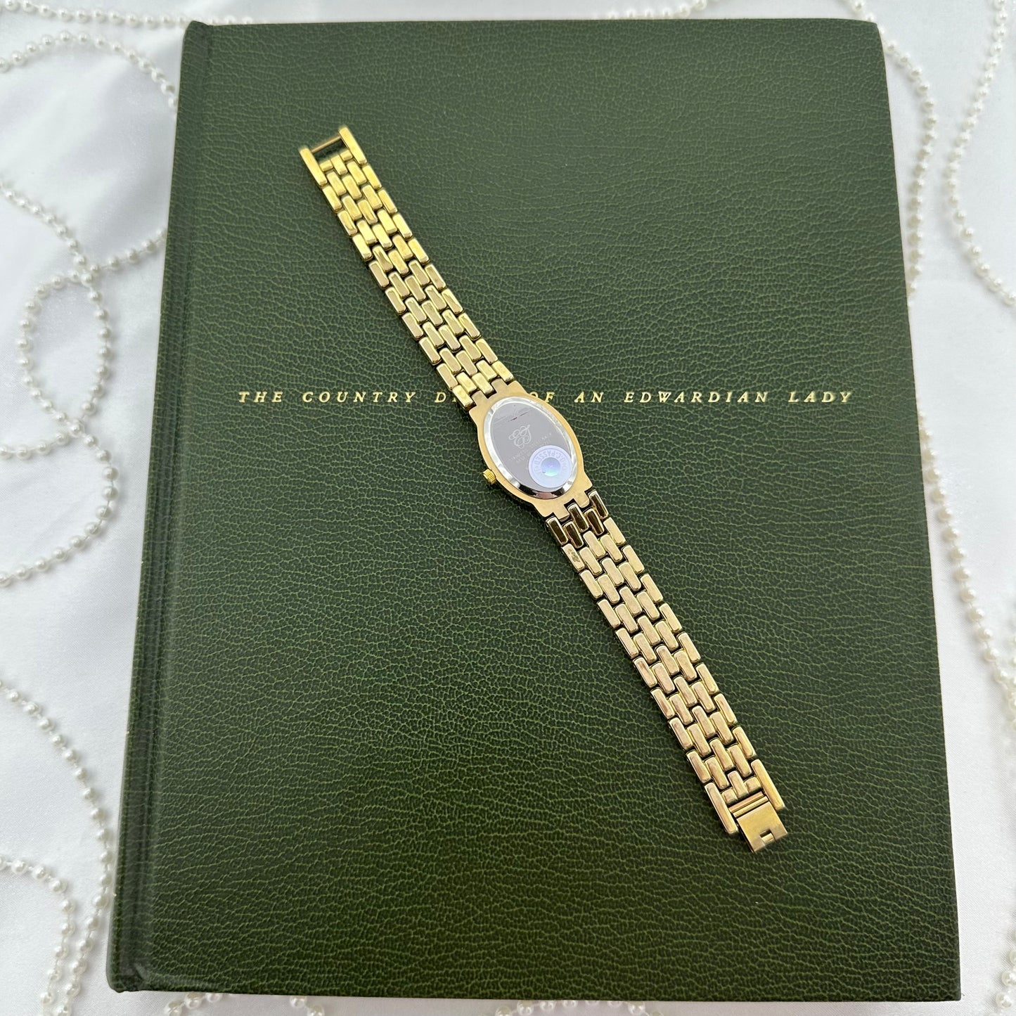 Elizabeth Taylor White Diamanté Gold Watch with Oval Dial