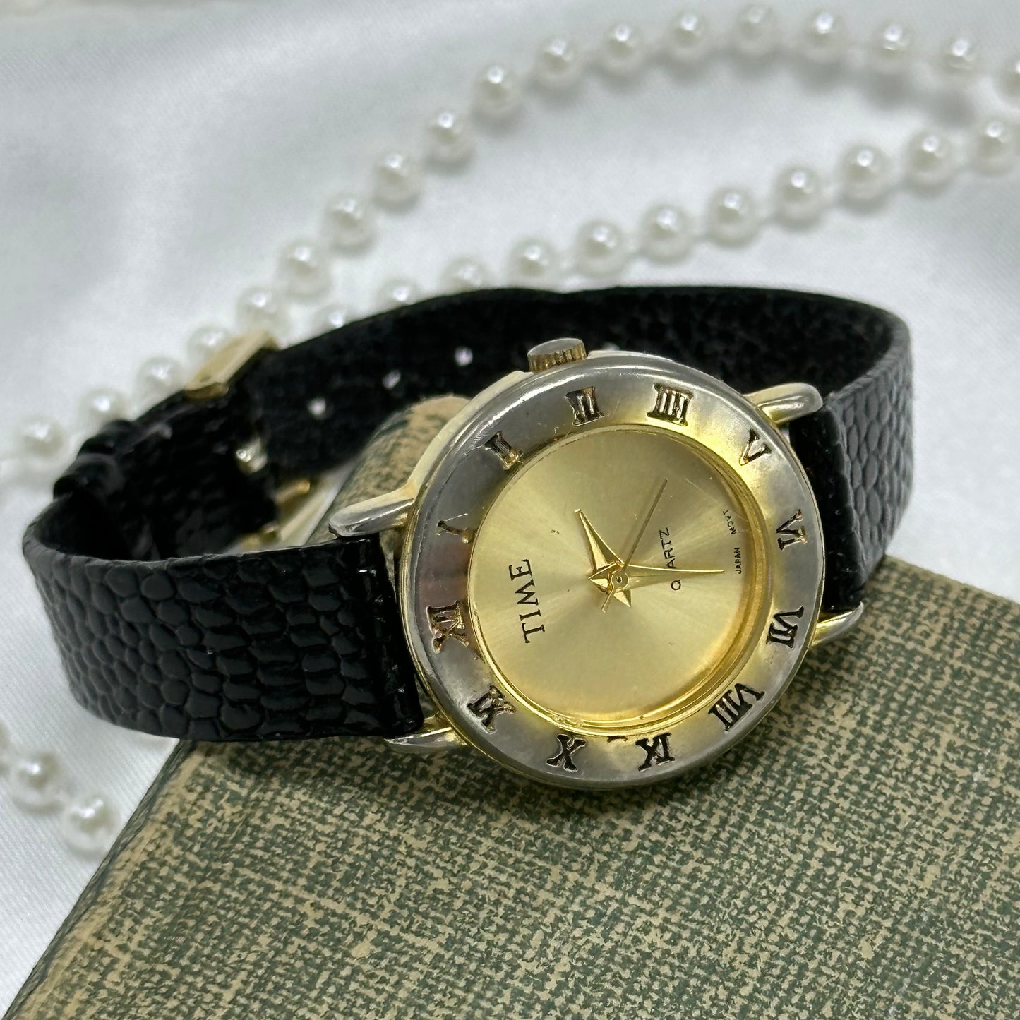 Gold Round Dial Watch with Roman Numeral Markers