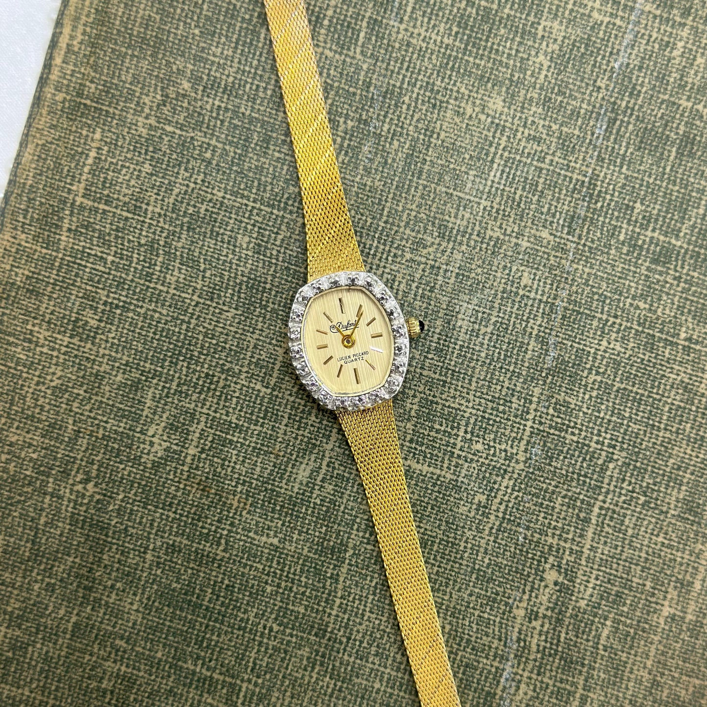 Gold Diamanté Lucien Piccard Watch with Blue Jewel Crown