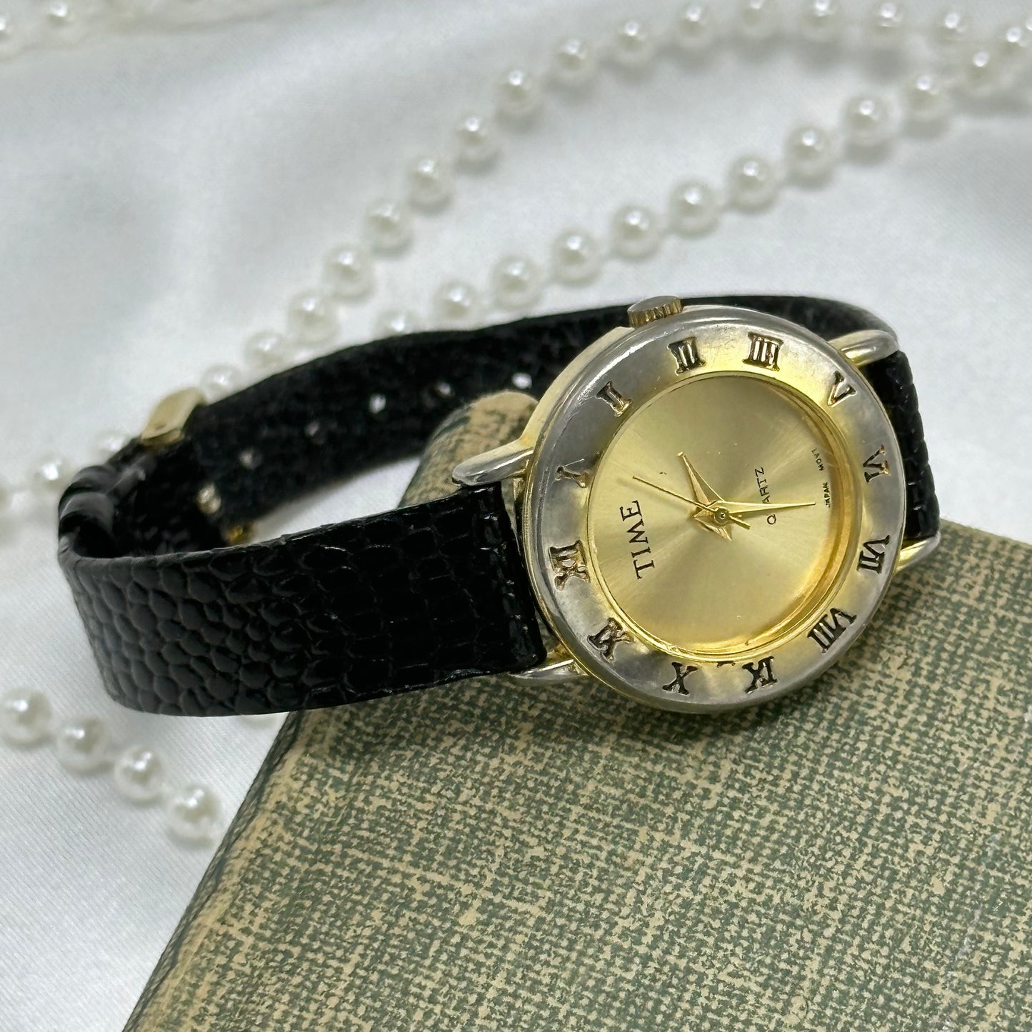 Gold Round Dial Watch with Roman Numeral Markers