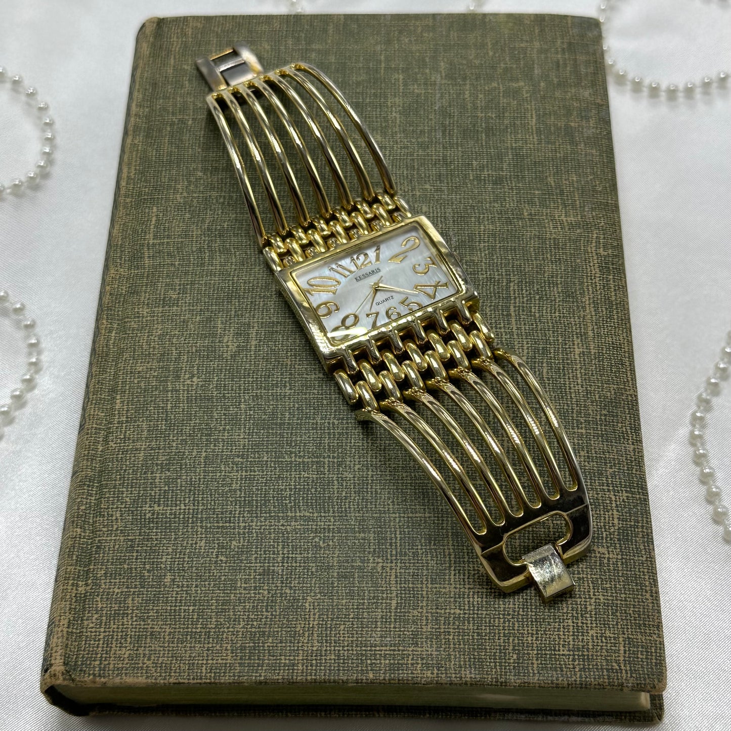 Chunky Gold Cuff Watch with Mother of Pearl Dial