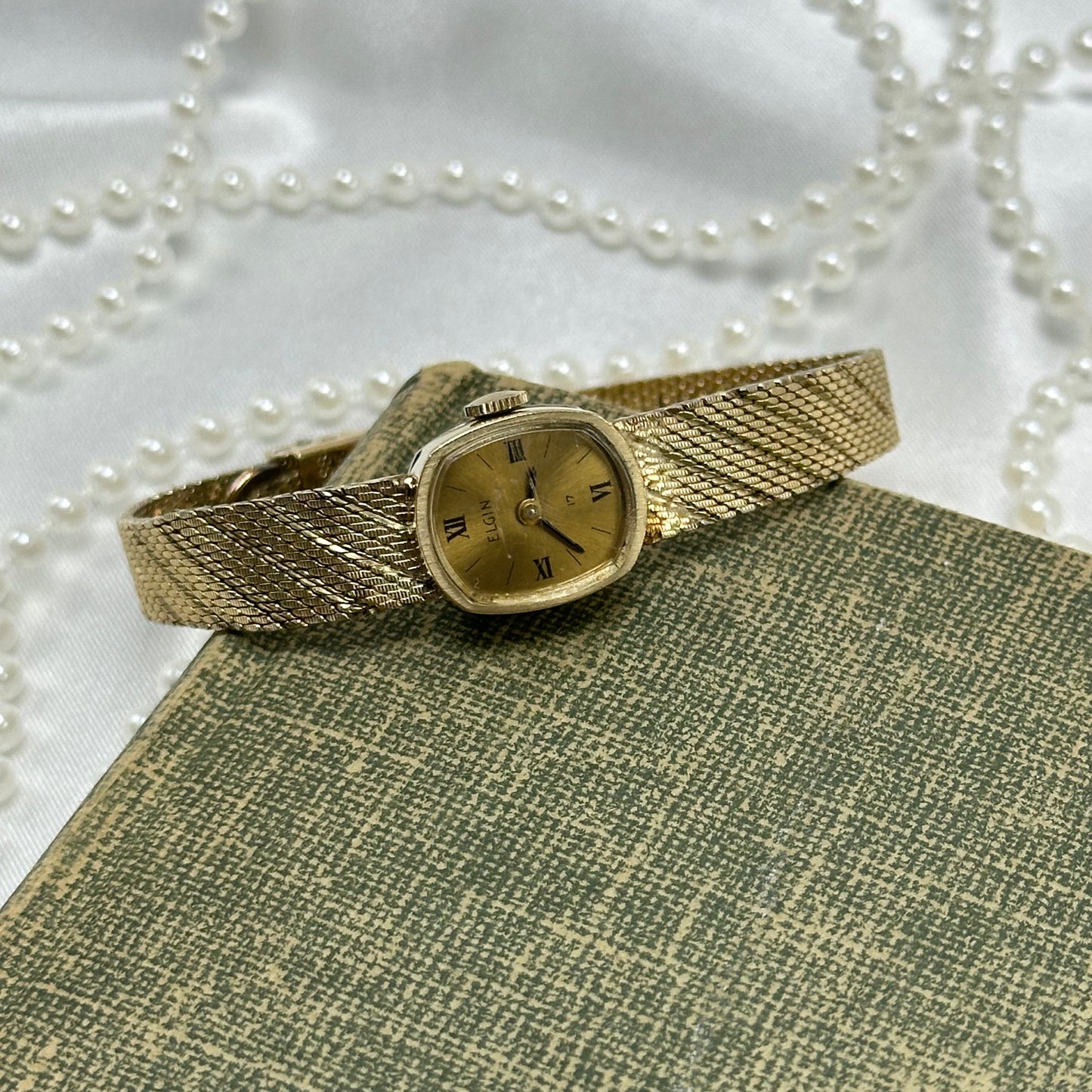 Slender Gold Vintage Wind-Up Elgin Watch with Roman Numeral Markers