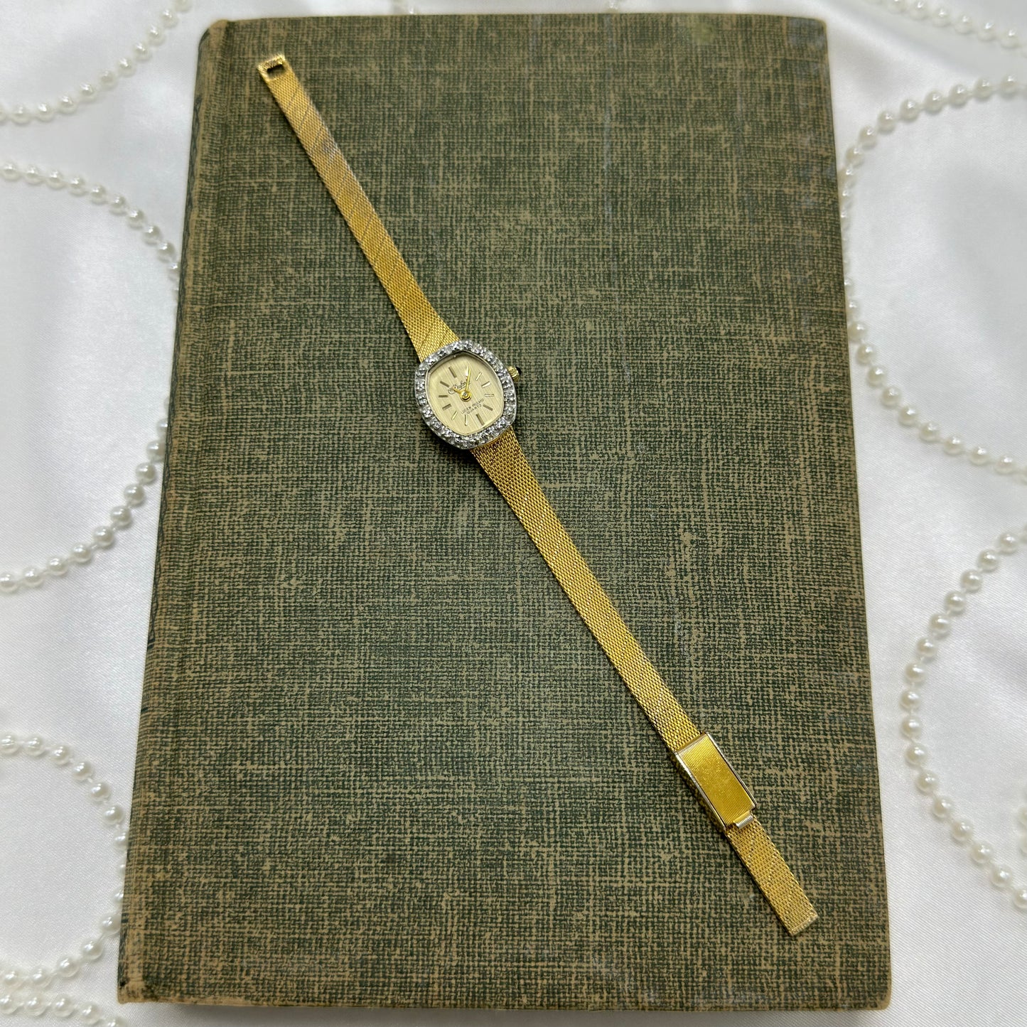 Gold Diamanté Lucien Piccard Watch with Blue Jewel Crown