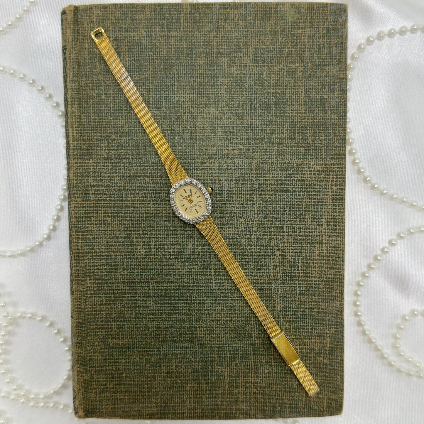 Gold Diamanté Lucien Piccard Watch with Blue Jewel Crown