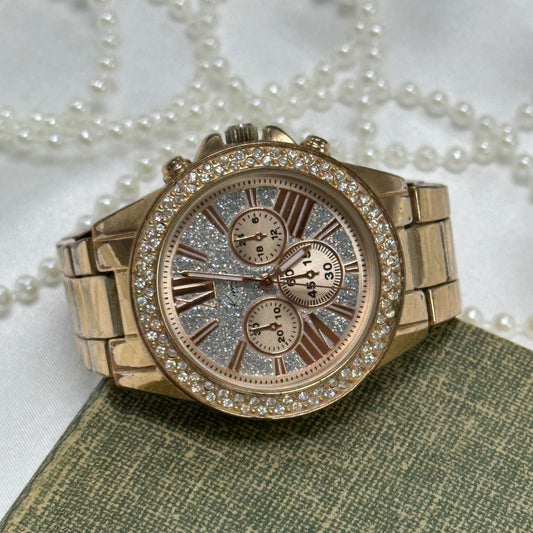 Rose gold tone diamanté and glitter dial Kim Rogers watch with double locking fold over clasp and 3 decor dials.