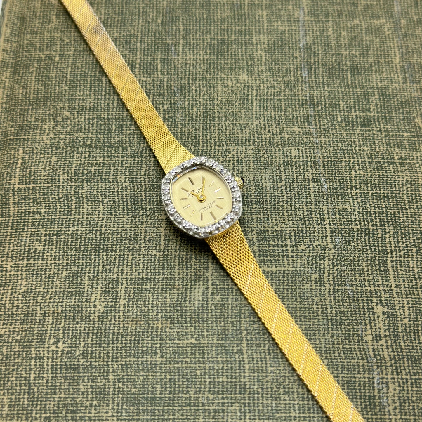 Gold Diamanté Lucien Piccard Watch with Blue Jewel Crown