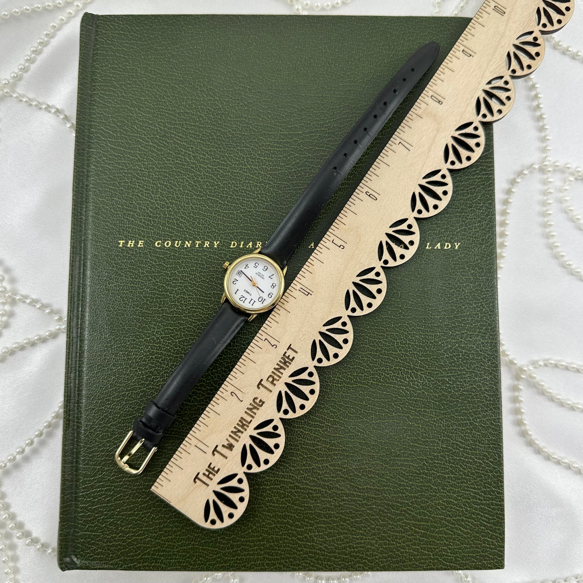 Classic Gold Timex Indiglo Watch with Black Leather Band and Date Display