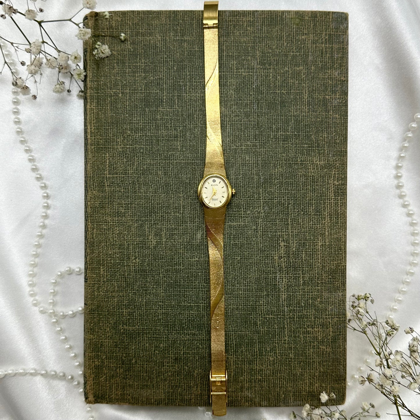 Gold tone Elgin Diamond watch with quartz movement.