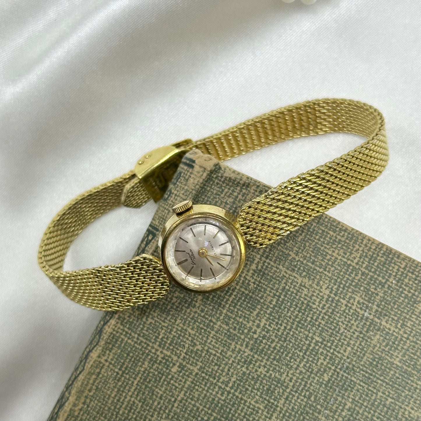 Dainty gold tone Germinal Voltaire manual winding watch. 17 jewels