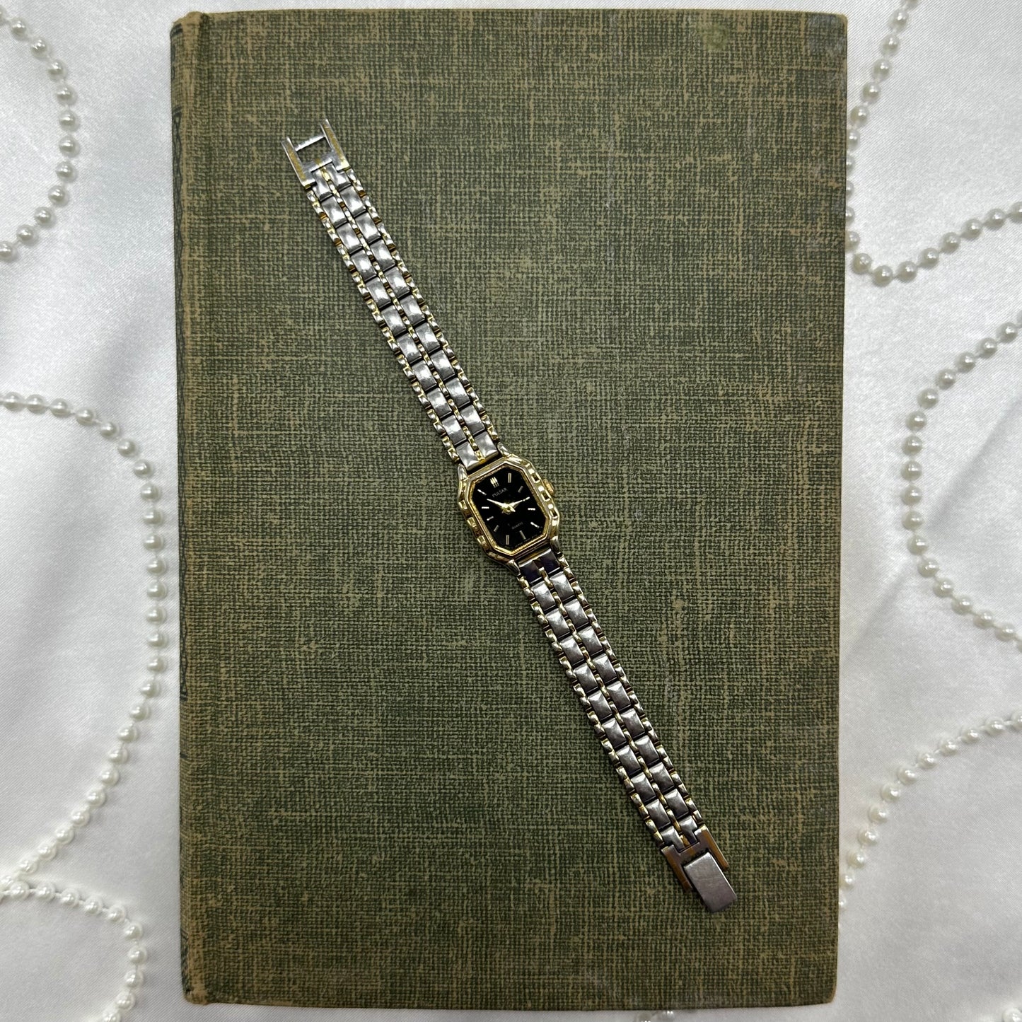 Dainty vintage silver and gold tone Pulsar watch with quartz movement.