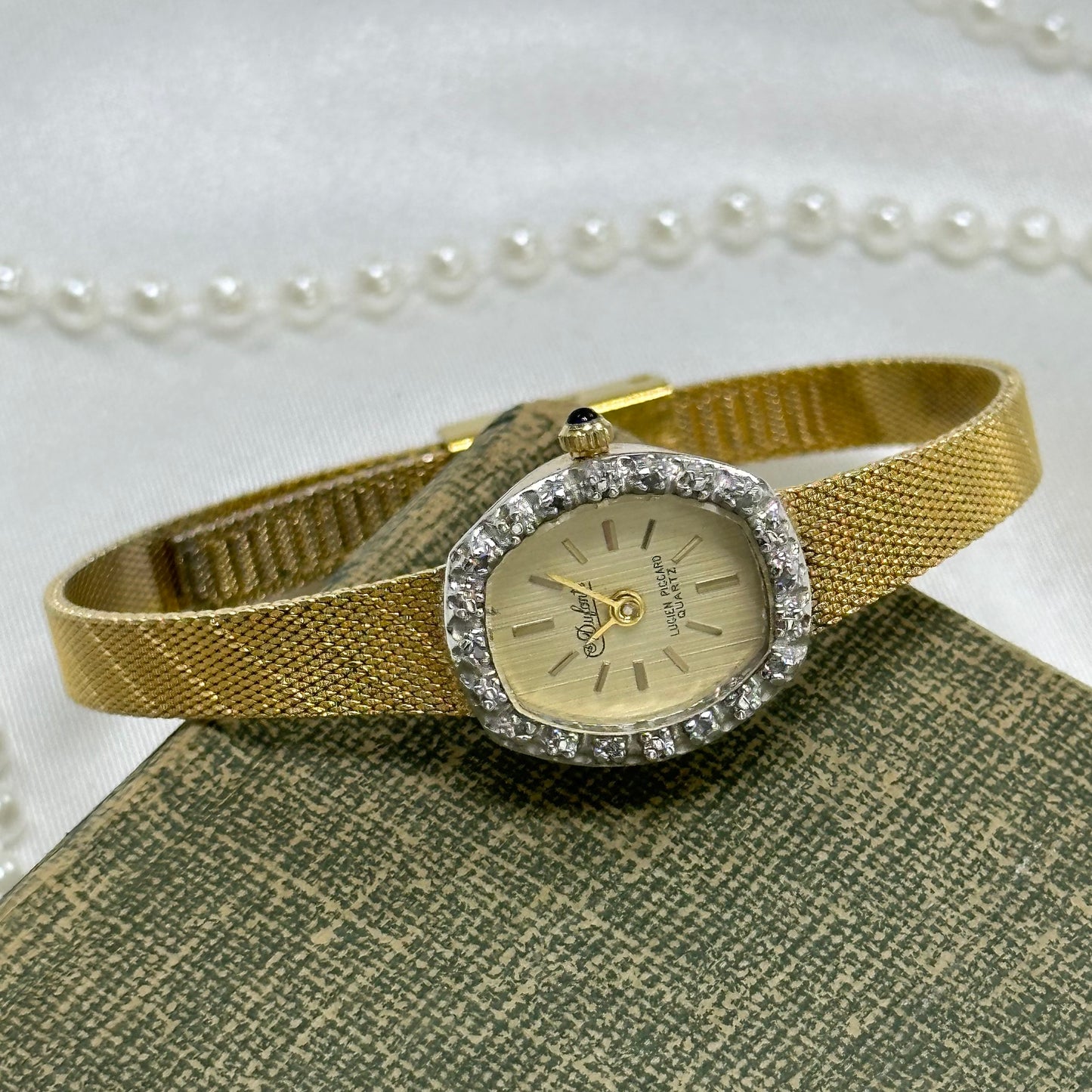 Gold Diamanté Lucien Piccard Watch with Blue Jewel Crown