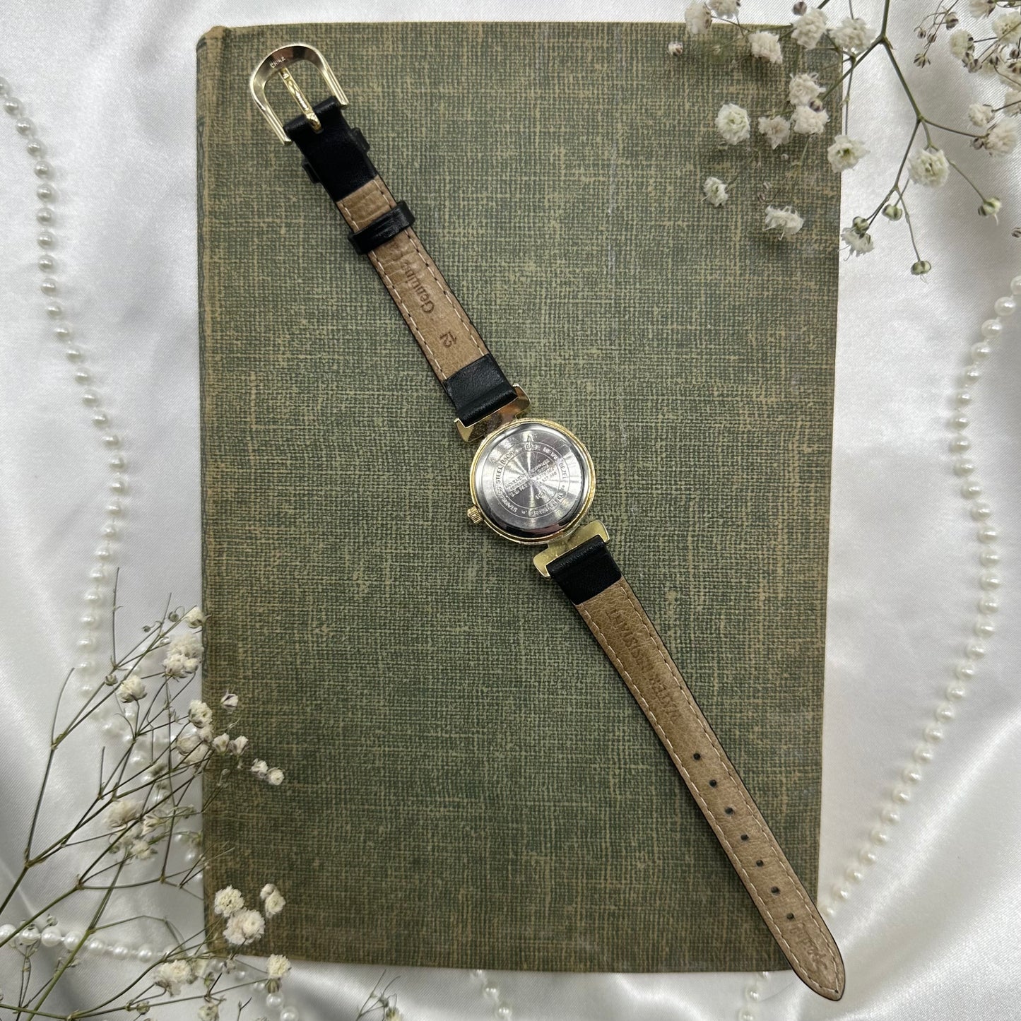 Gold tone Carriage watch with genuine leather black band and quartz