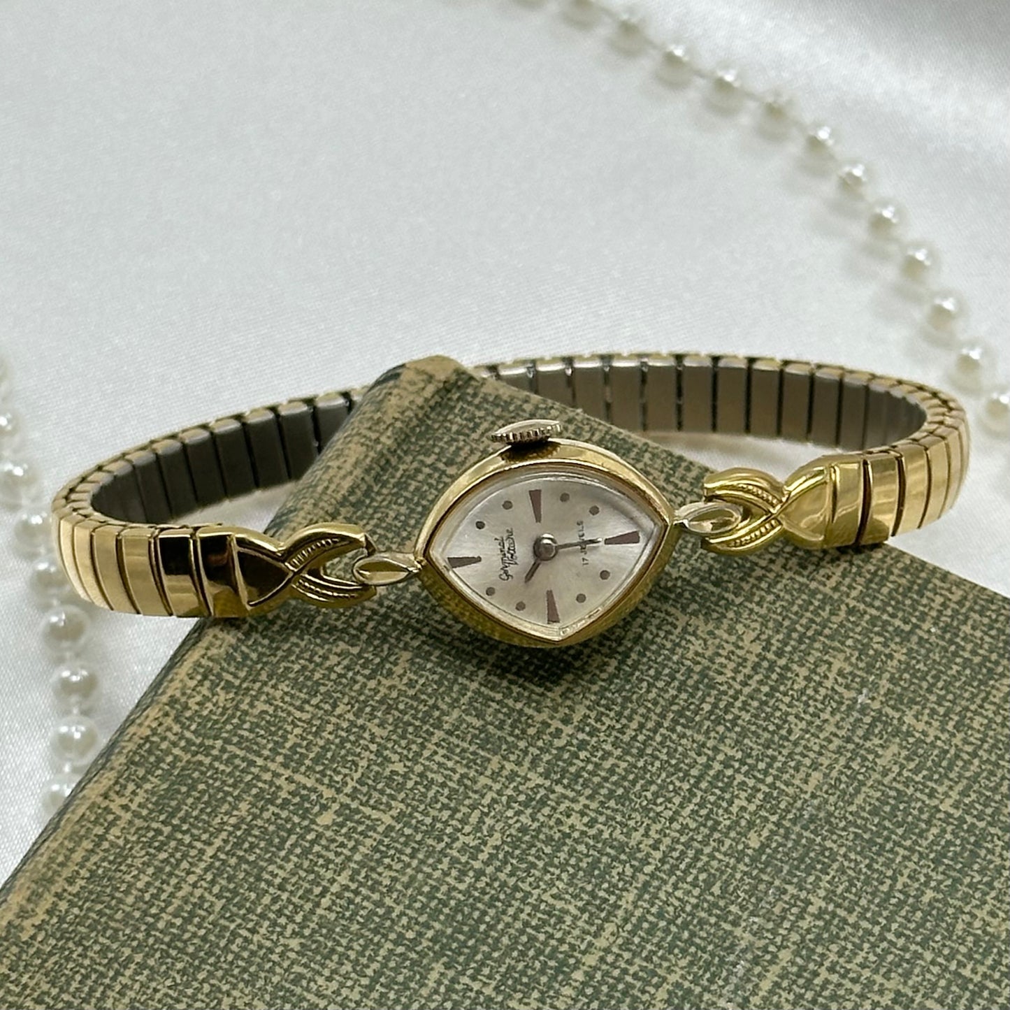 Gold tone Germinal Voltaire 17 jewels manual winding watch with stretchable band