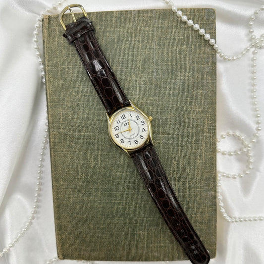 Gold tone LTD round dial watch with quartz movement