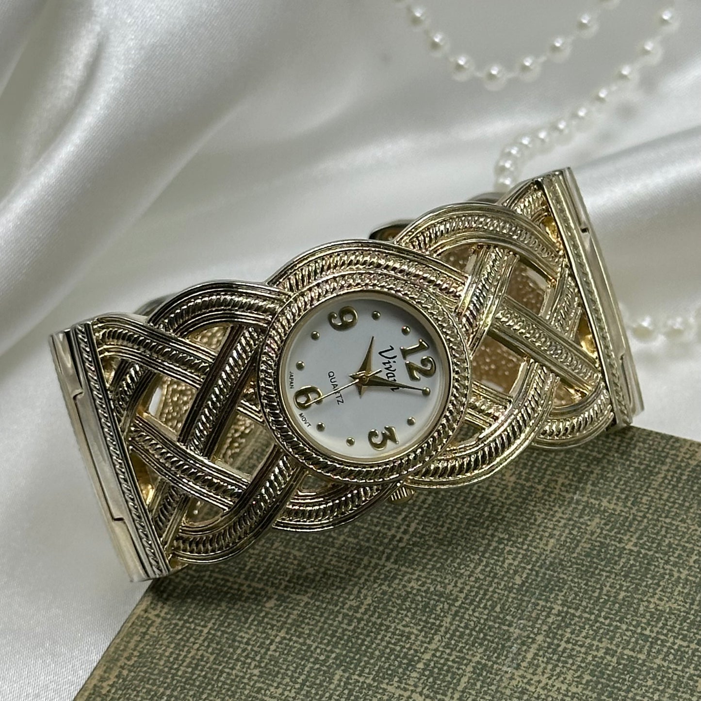 Gold tone Vivan cuff watch with quartz movement