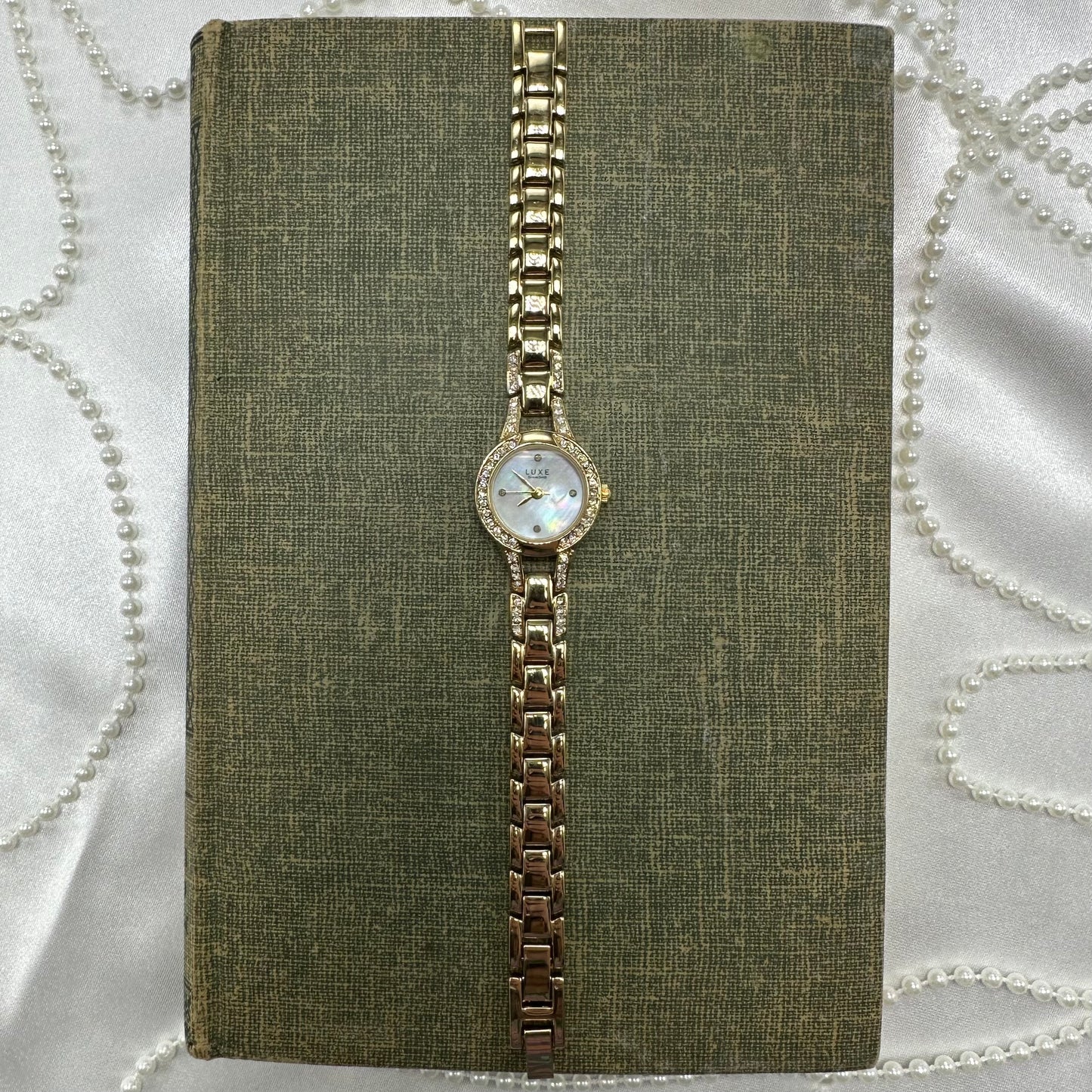 Gold tone diamanté Luxe Diamond watch with mother of pearl dial and quartz movement.