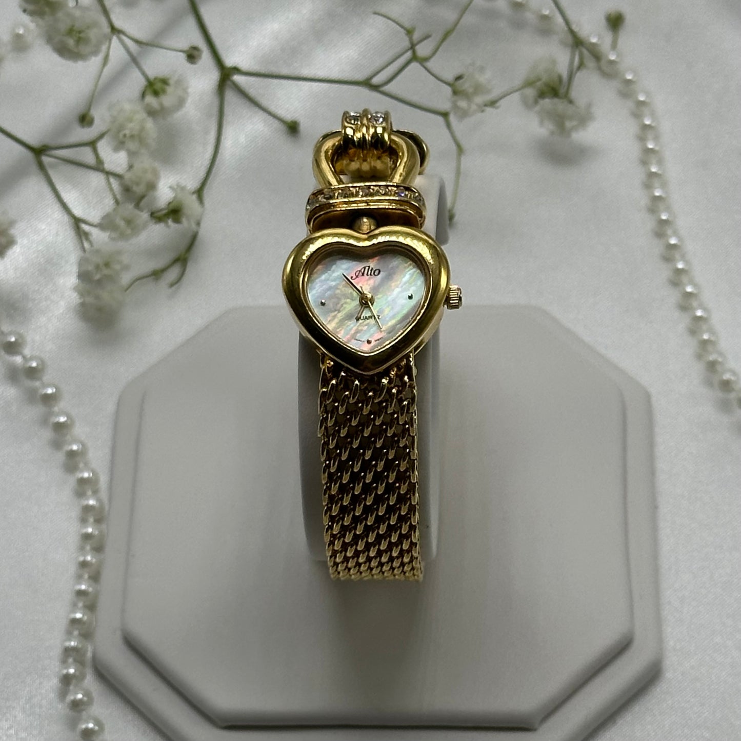 Gold tone mother of pearl heart dial Alto watch