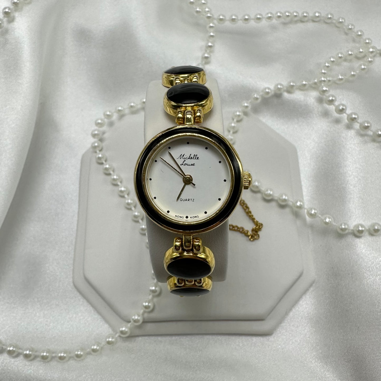 Gold tone round dial watch with quartz movement
