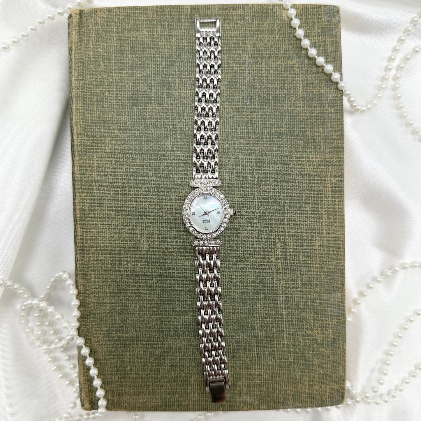 Mother of Pearl Watch with Blue Jewel Crown
