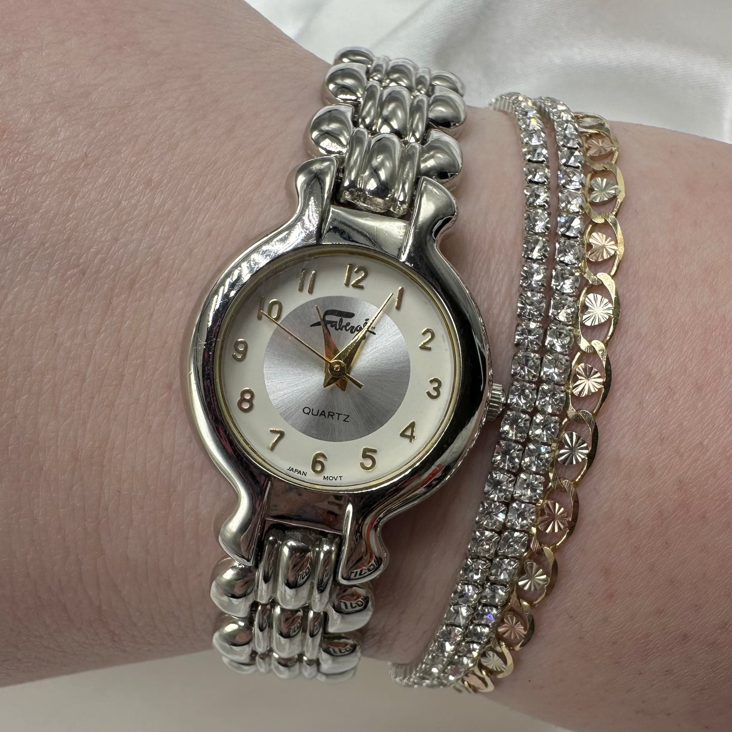 Silver Round Dial Watch with Gold Hands