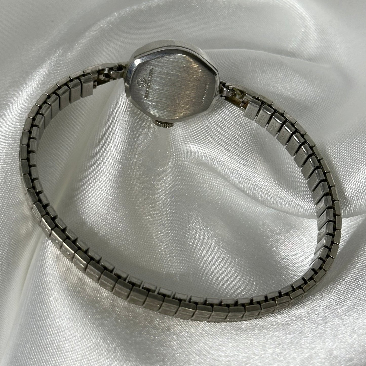 Silver Tone Bulova manual winding watch with stretchable band