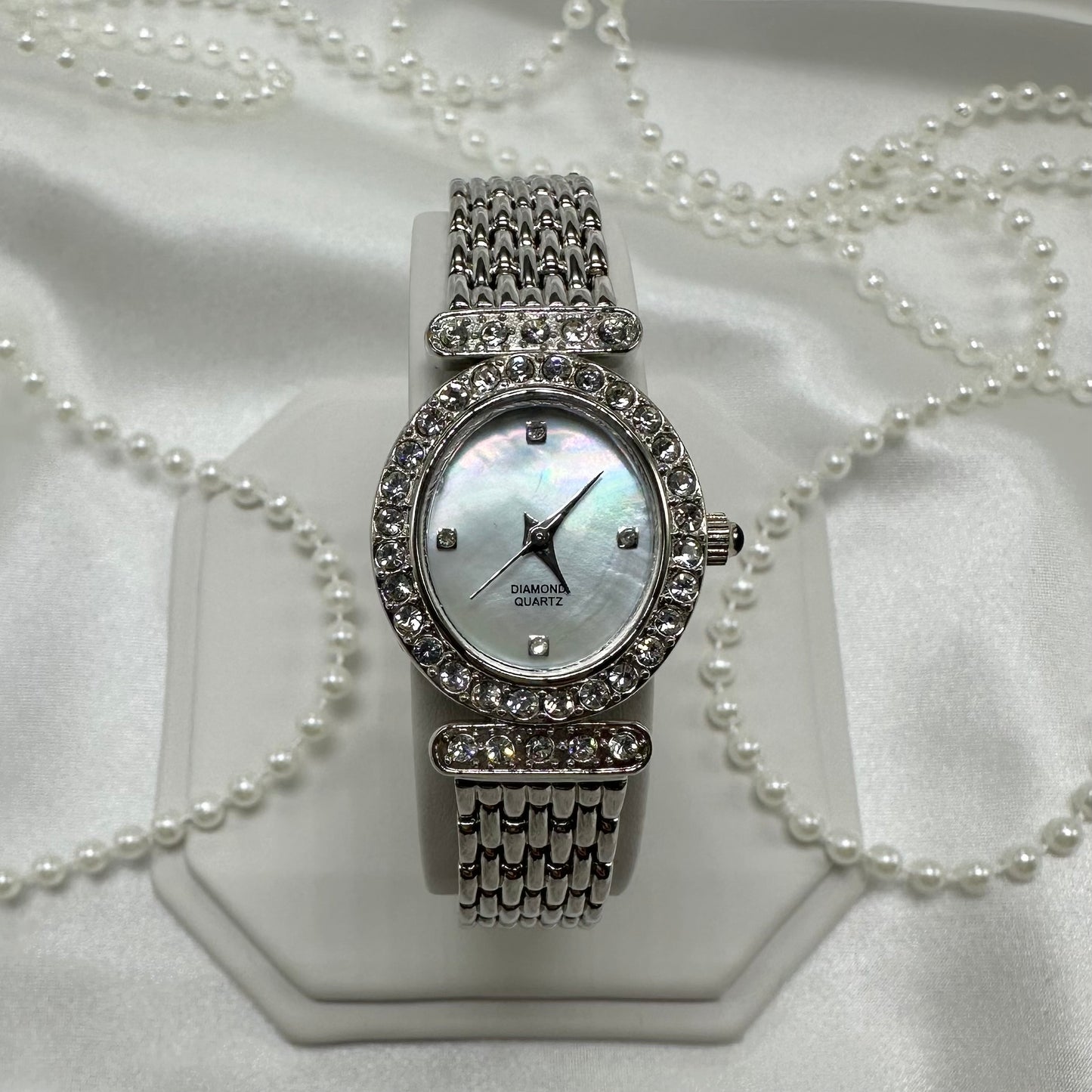 Silver diamanté oval dial watch with quartz movement and mother of pearl dial
