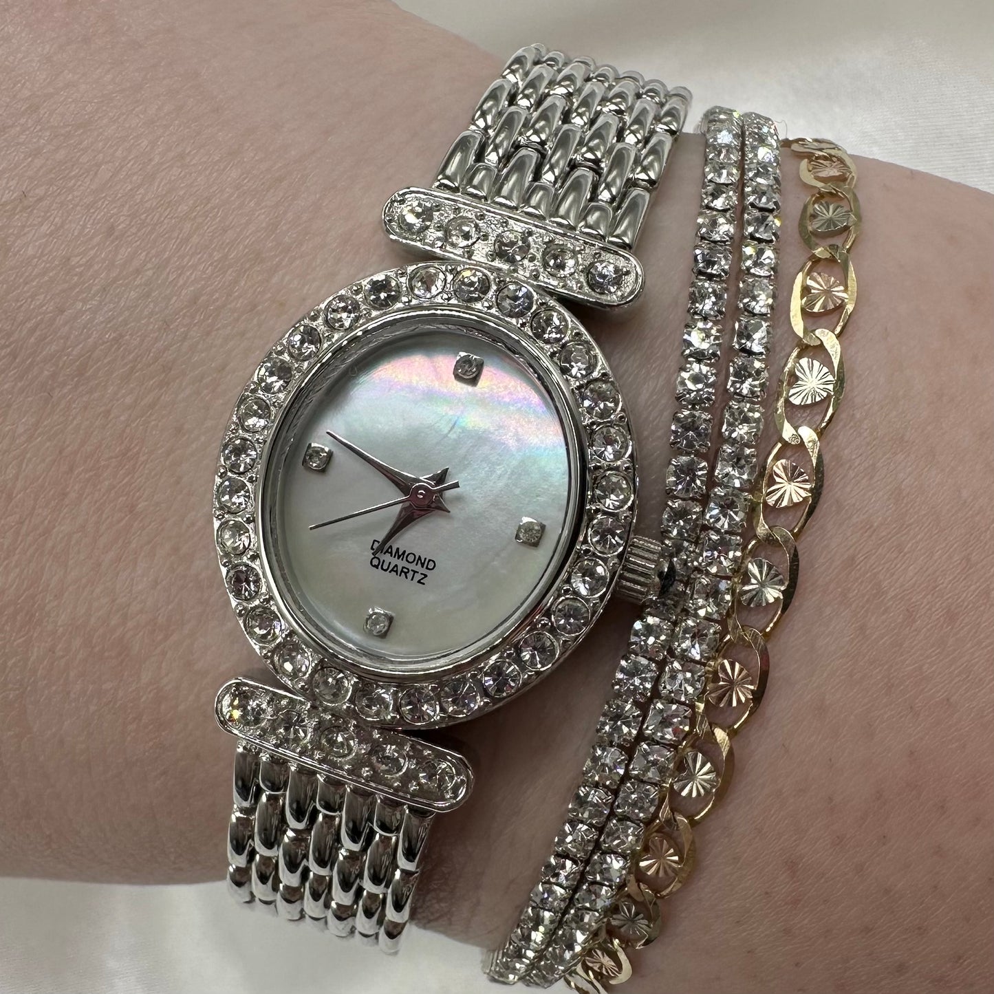 Silver diamanté oval dial watch with quartz movement and mother of pearl dial