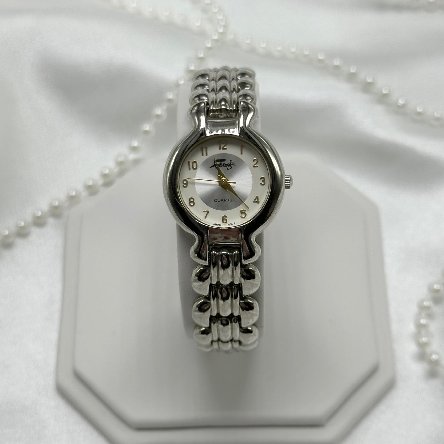 Silver tone Fabergé round dial women's watch with quartz movement
