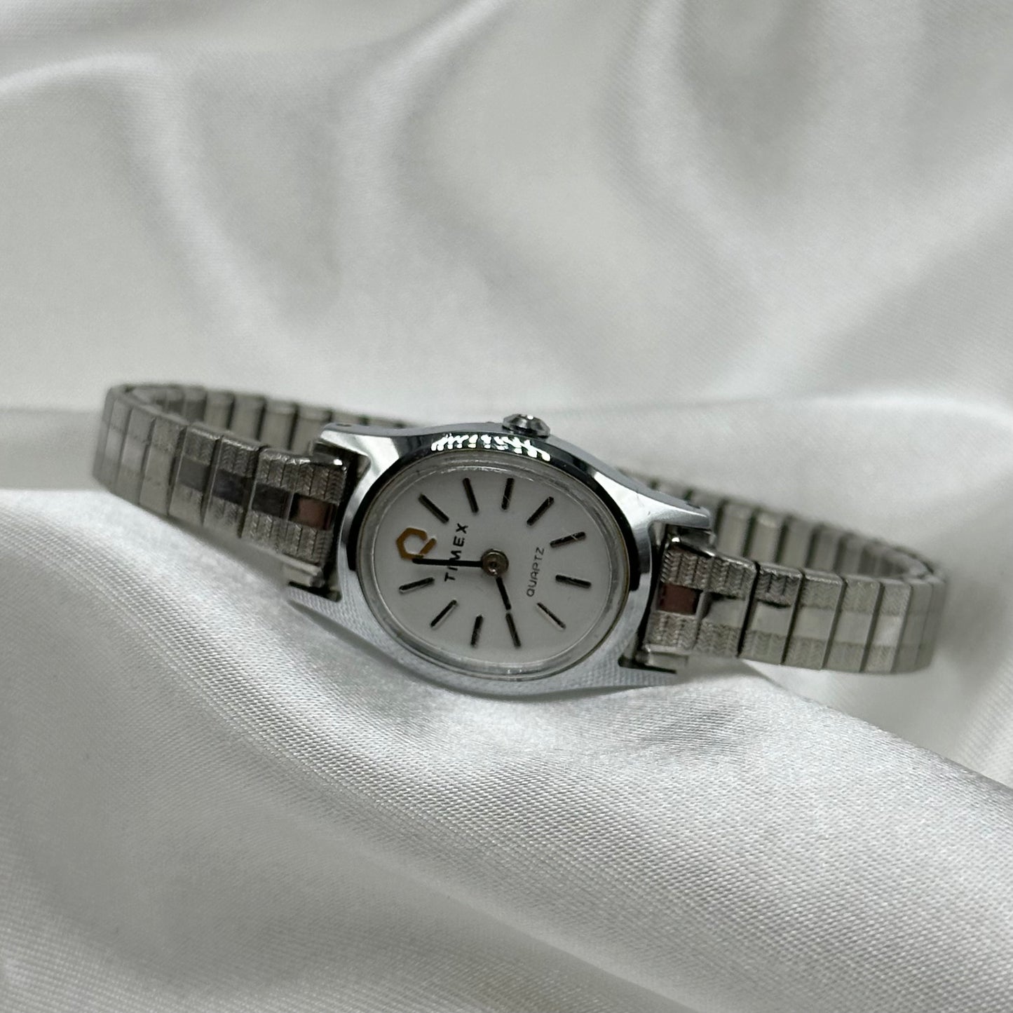 Silver tone Timex oval dial watch with quartz movement