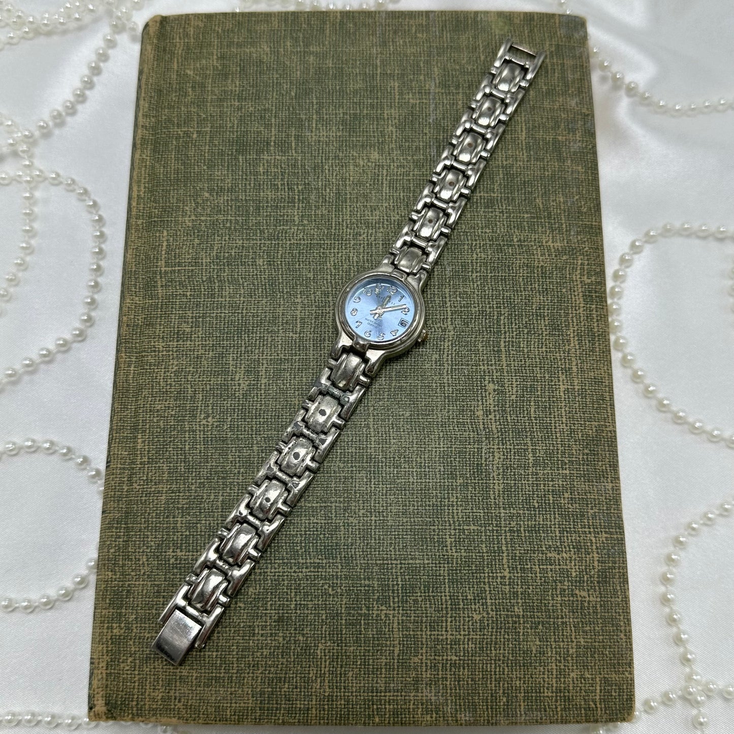 Silver tone light blue dial LA Express watch with date display and clasp band