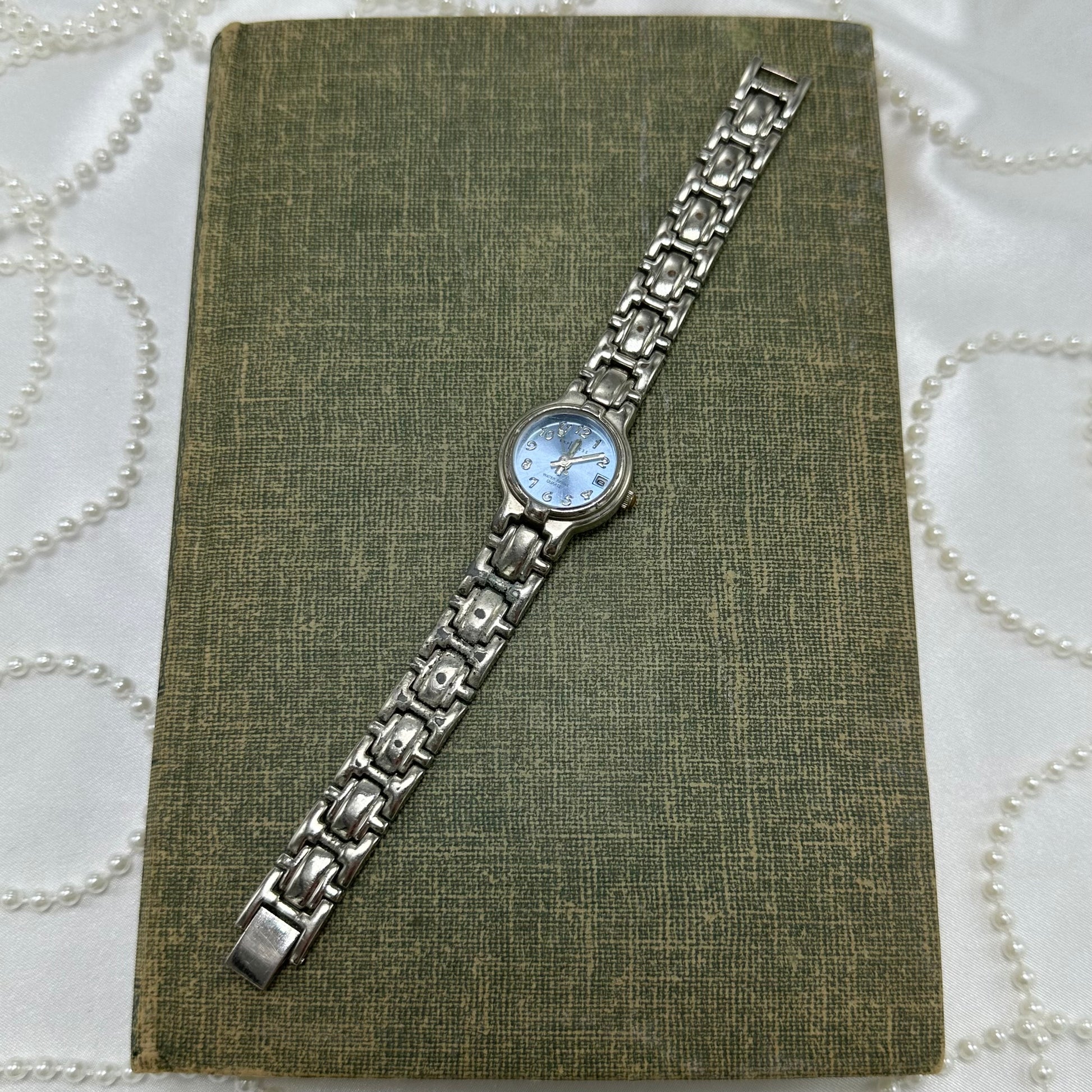 Silver tone light blue dial LA Express watch with date display and clasp band