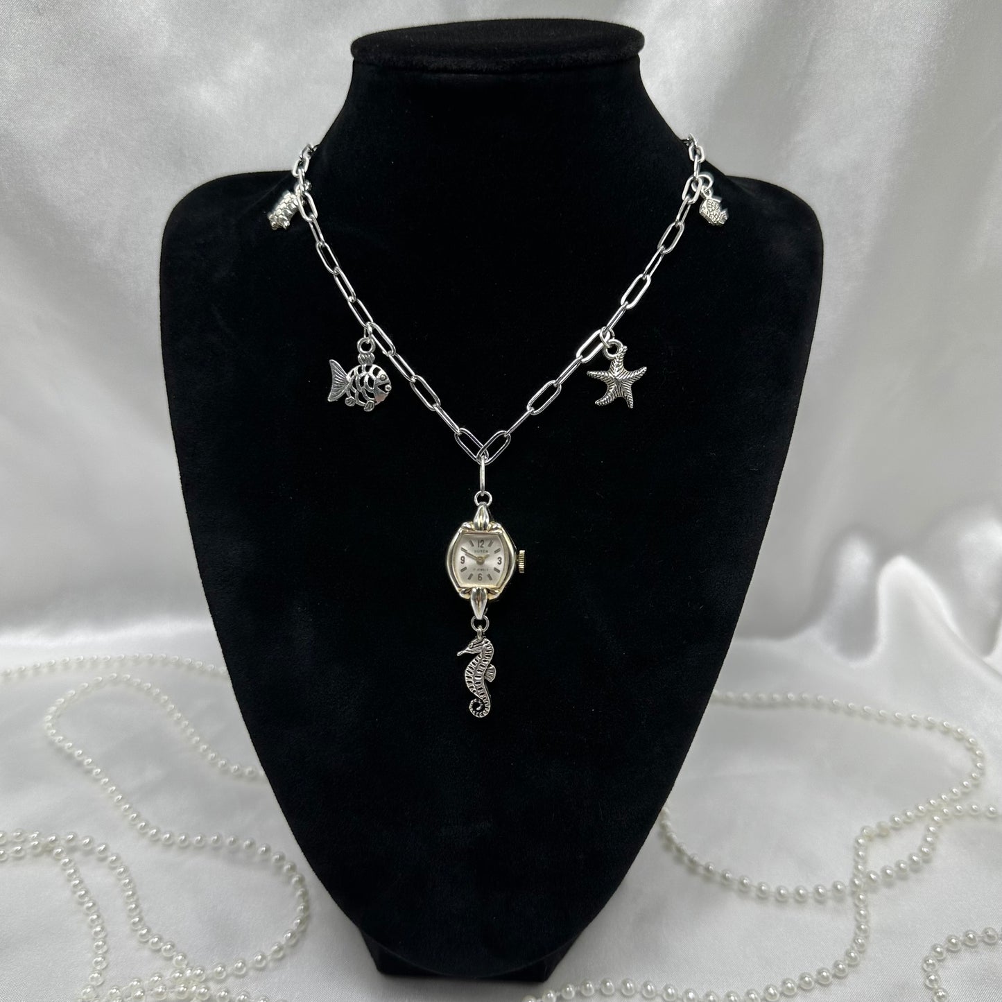 Silver tone paper clip chain charm necklace with vintage watch pendant. Watch does not run. Nickle free stainless steel chain.