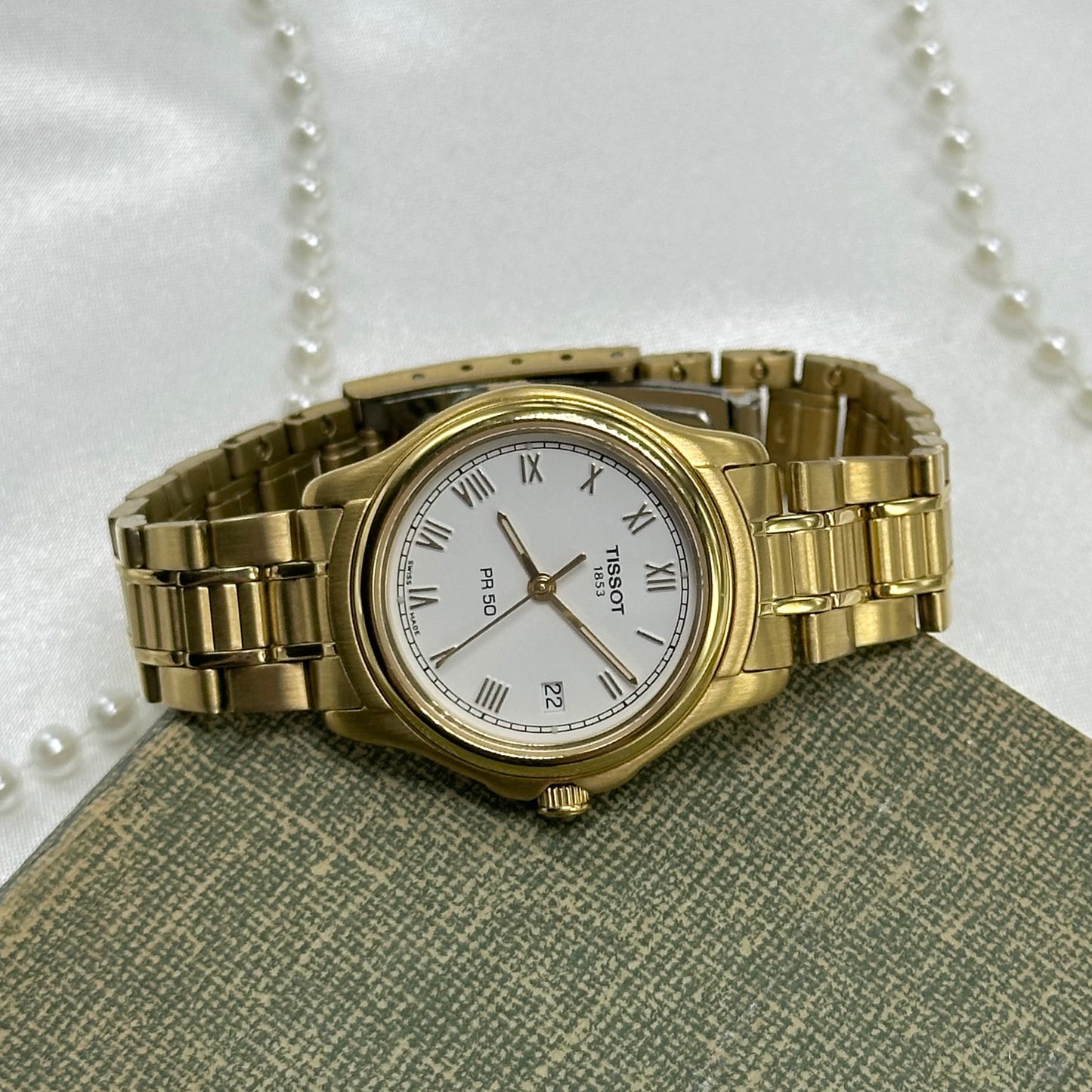 Tissot 1853 Pro 50 gold tone watch with date display