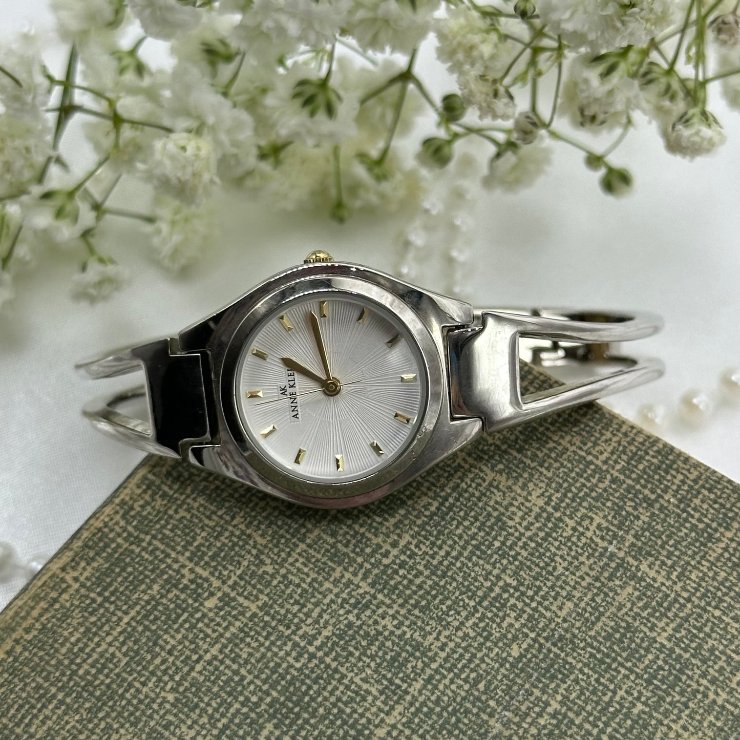 Vintage Anne Klein silver tone cuff watch with quartz movement