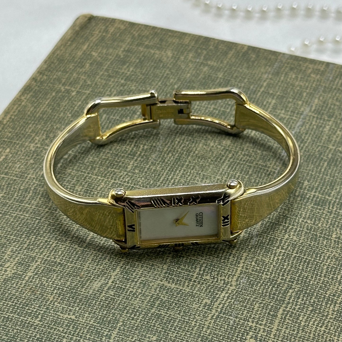 Vintage Citizen gold tone cuff watch with mother of pearl dial and clasp band