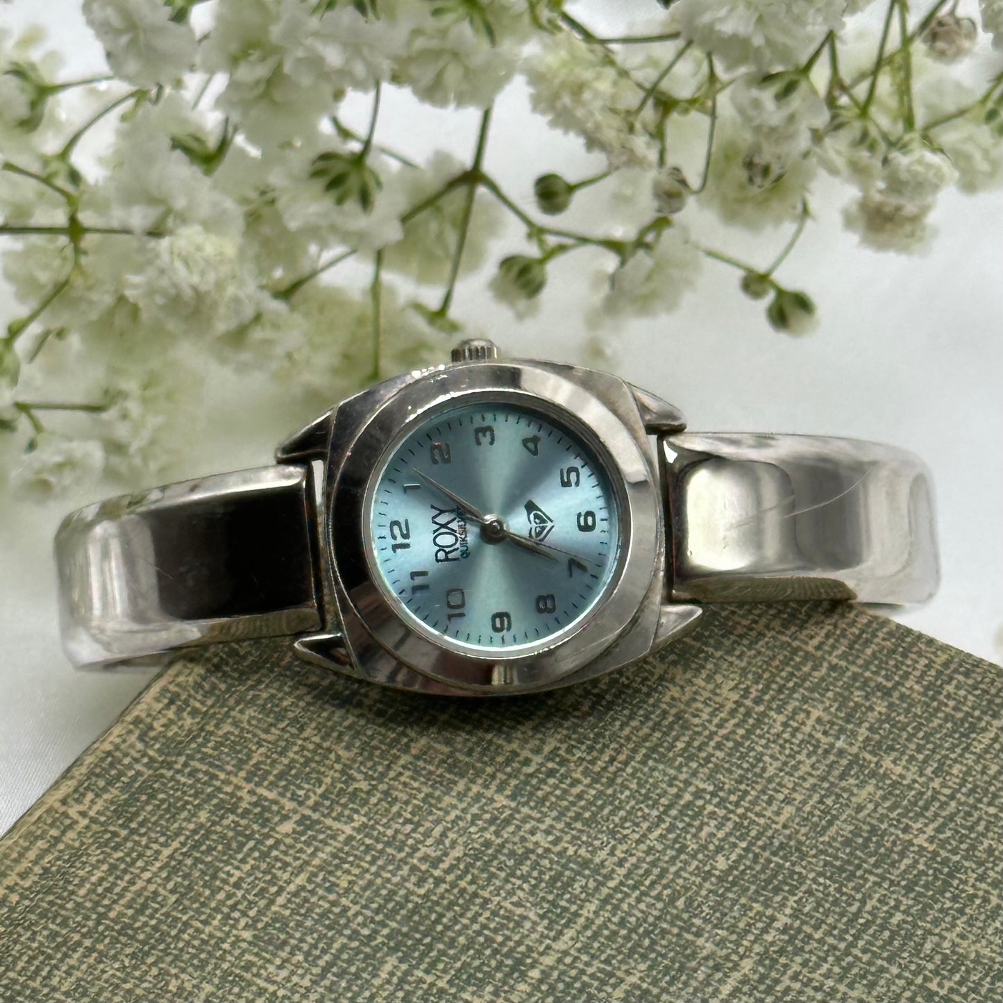 Vintage ROXY Quiksilver cuff watch with blue dial.