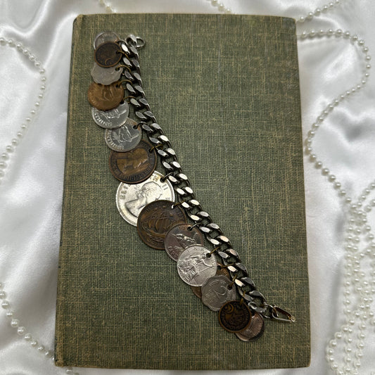 Vintage charm style coin bracelet. Coins are from various countries and date around the 1950's.