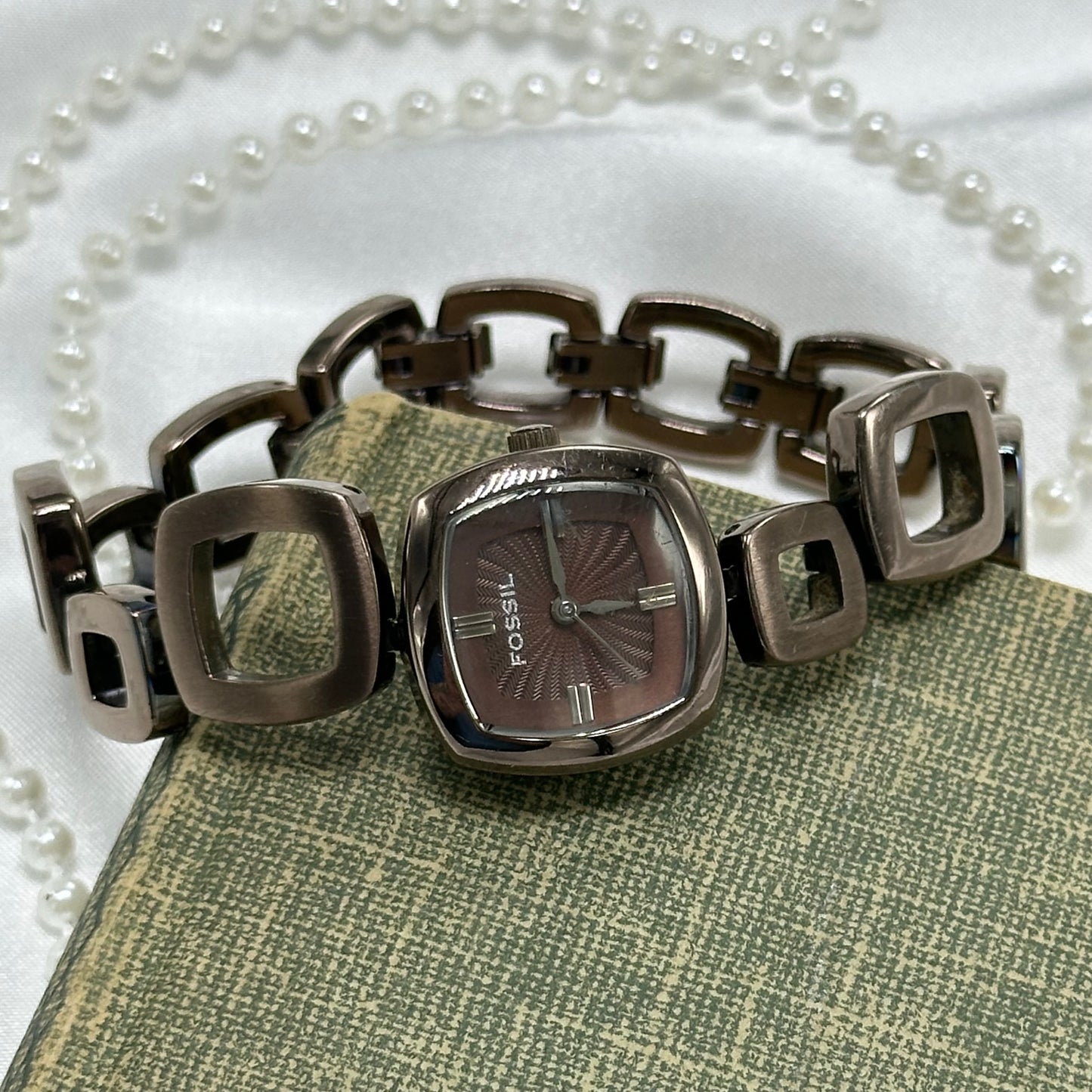 Vintage chocolate brown color Fossil watch with abstract funky clasp band and textured square dial.
