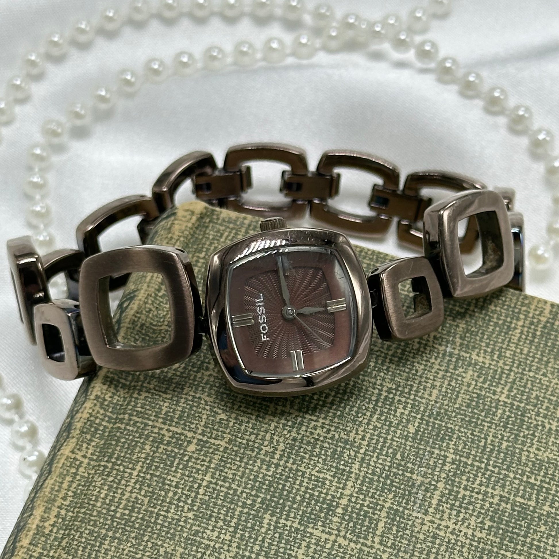 Vintage chocolate brown color Fossil watch with abstract funky clasp band and textured square dial.