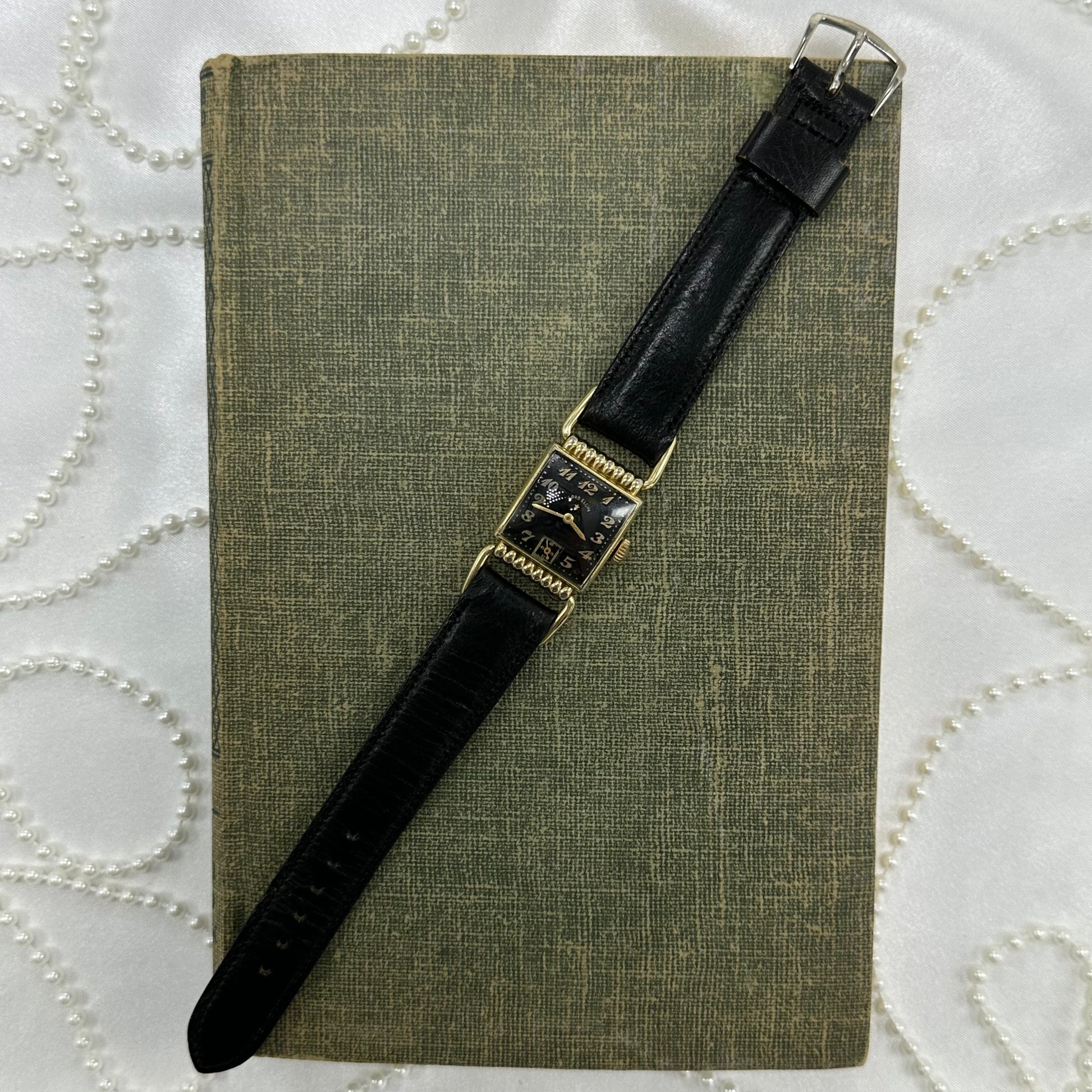 Vintage gold tone Lord Elgin black dial watch with black Norwegian calf band and second dial.