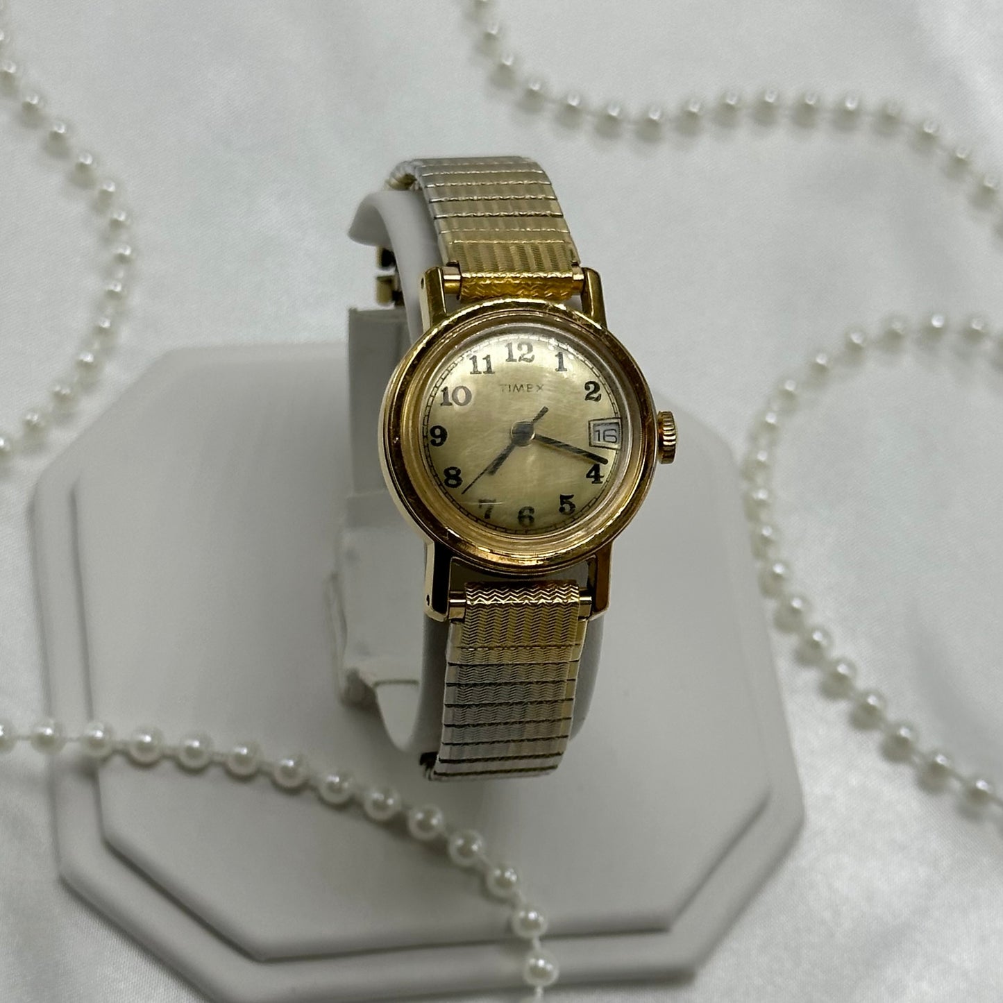 Vintage gold tone Timex manual winding watch with date display