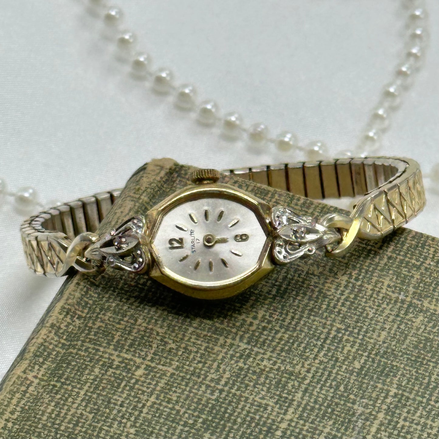 Vintage gold tone diamanté manual winding Starlite watch. Watch is missing minute hand and crystal. Back is engraved with "Gerry".
