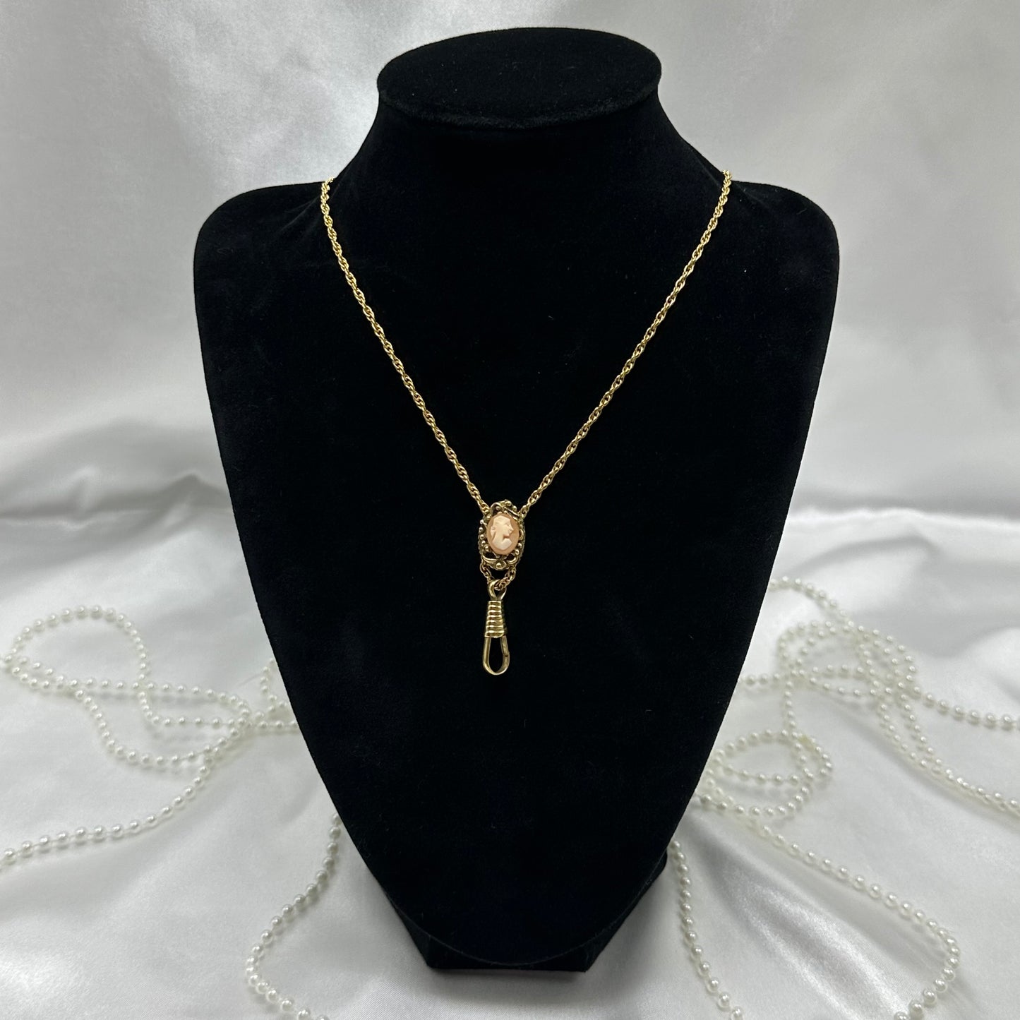 Vintage gold tone lariat necklace with cameo slide and watch hook. Hook is perfect for pendants, watches, reading glasses, etc.