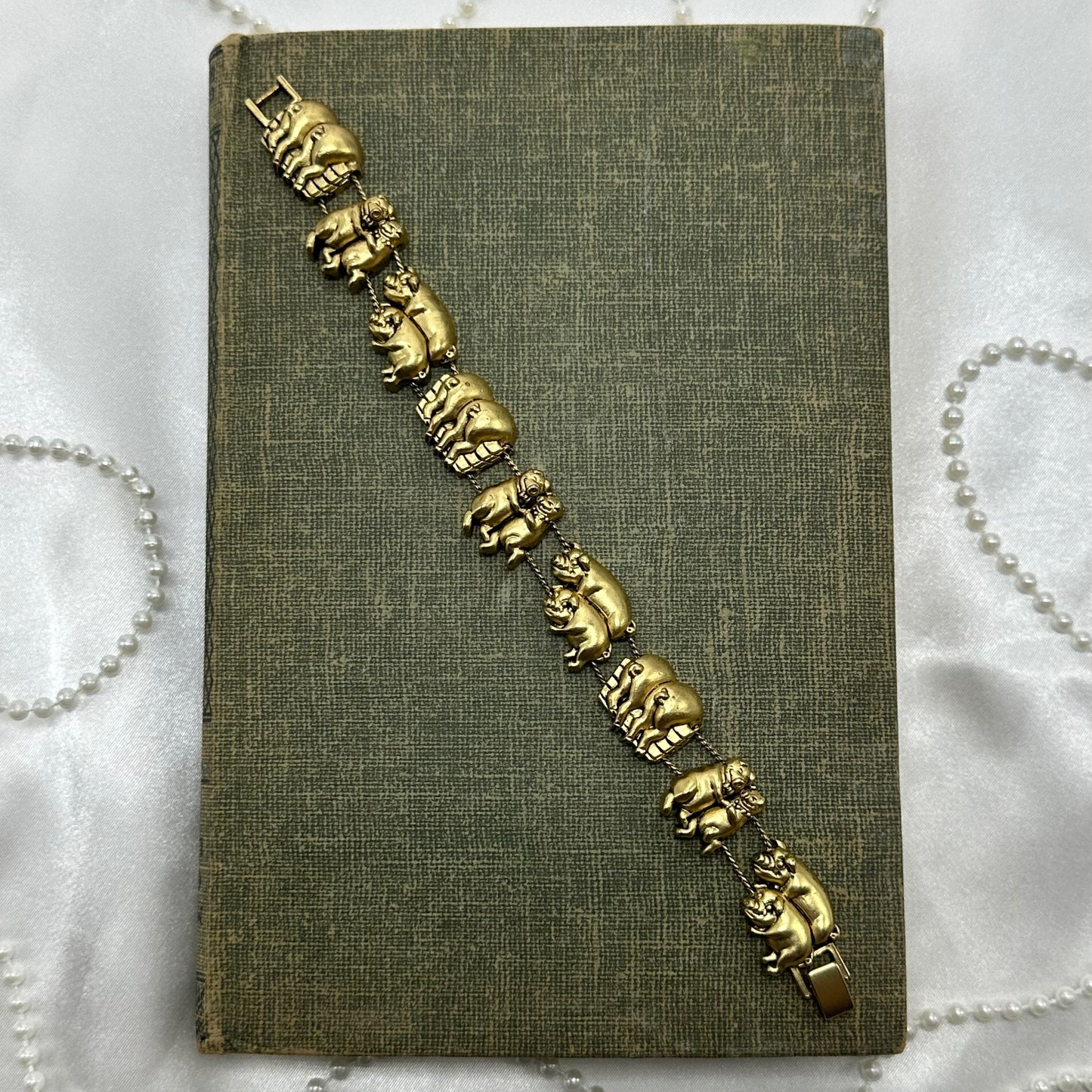Vintage gold tone pig charm bracelet.