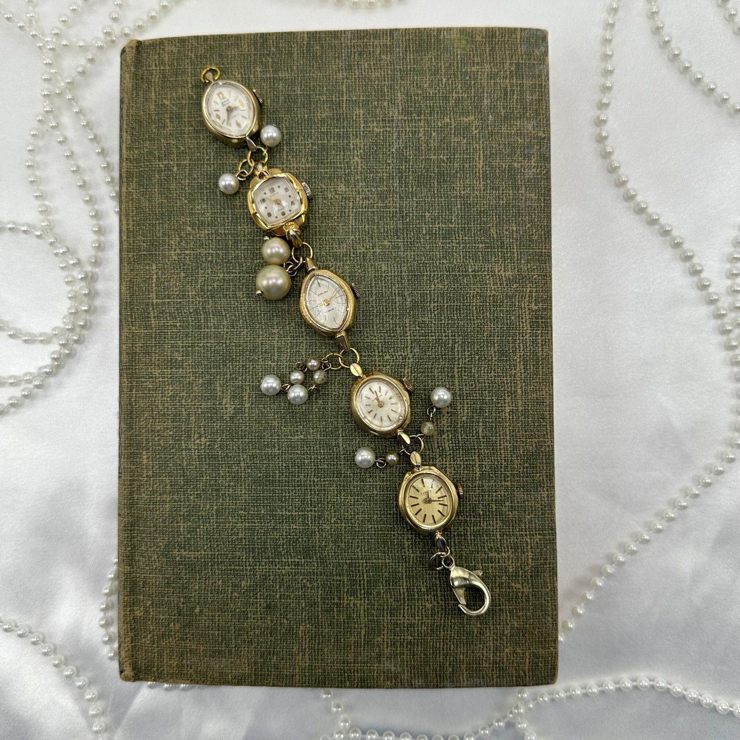 Vintage gold tone watch bracelet with pearl charms. 1 watch runs.