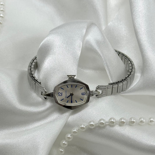 Vintage silver Bulova 10k rolled gold-plated manual winding watch with stretchable band from 1977