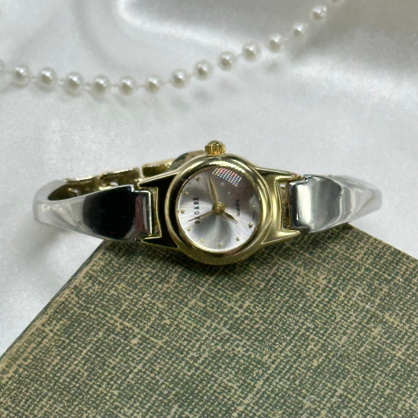 Vintage silver and gold tone Decade watch with with bubble face and quartz movement